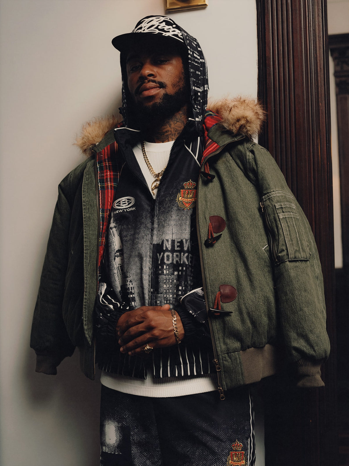 Squills (the rapper 454) and Brittney Shurley wearing Brigade FW26 in a Harlem Brownstone.
