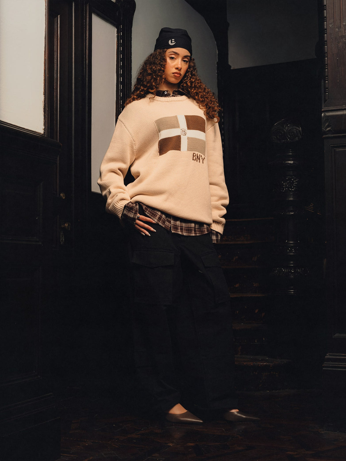 Squills (the rapper 454) and Brittney Shurley wearing Brigade FW26 in a Harlem Brownstone.