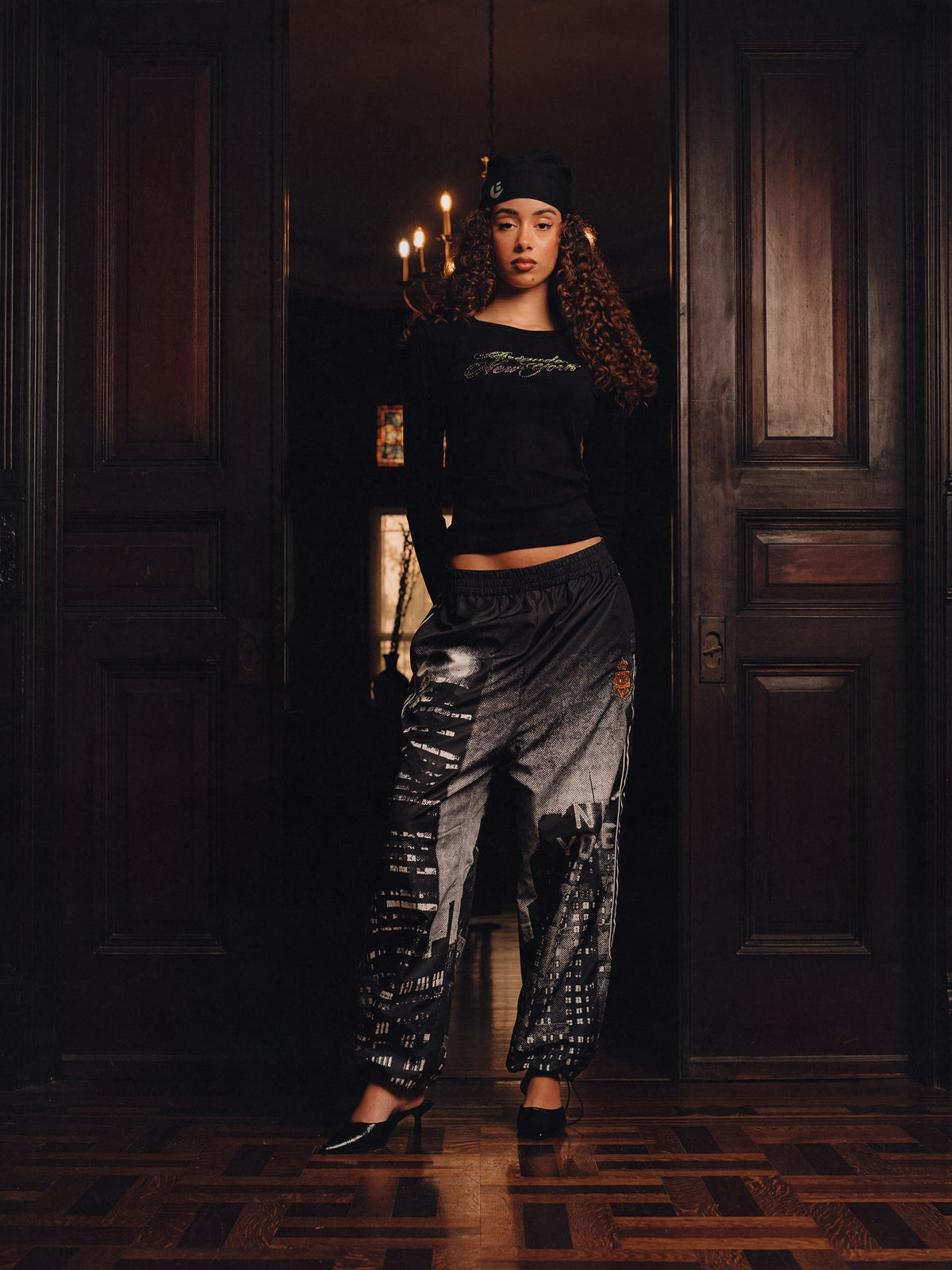 Squills (the rapper 454) and Brittney Shurley wearing Brigade FW26 in a Harlem Brownstone.