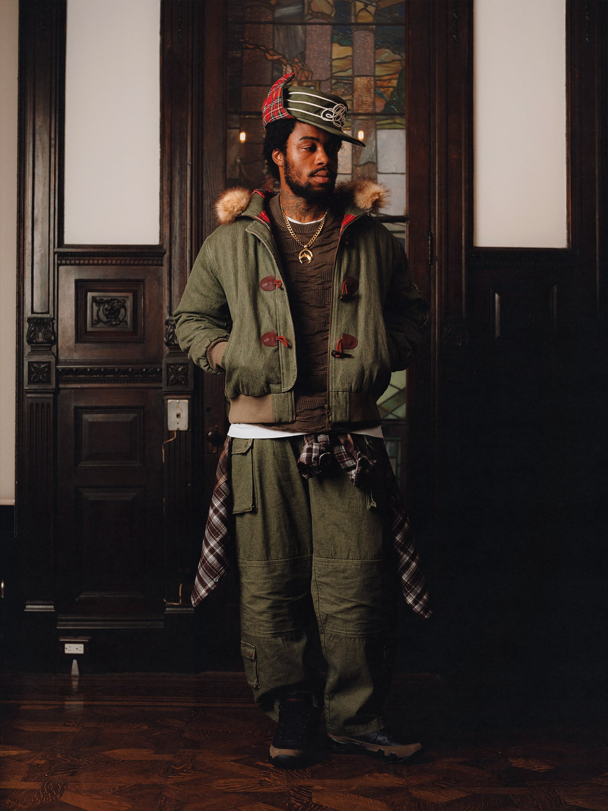 Squills (the rapper 454) and Brittney Shurley wearing Brigade FW26 in a Harlem Brownstone.