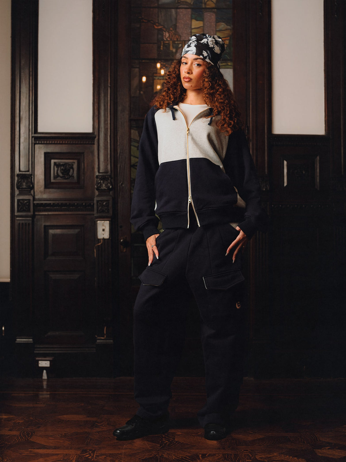 Squills (the rapper 454) and Brittney Shurley wearing Brigade FW26 in a Harlem Brownstone.