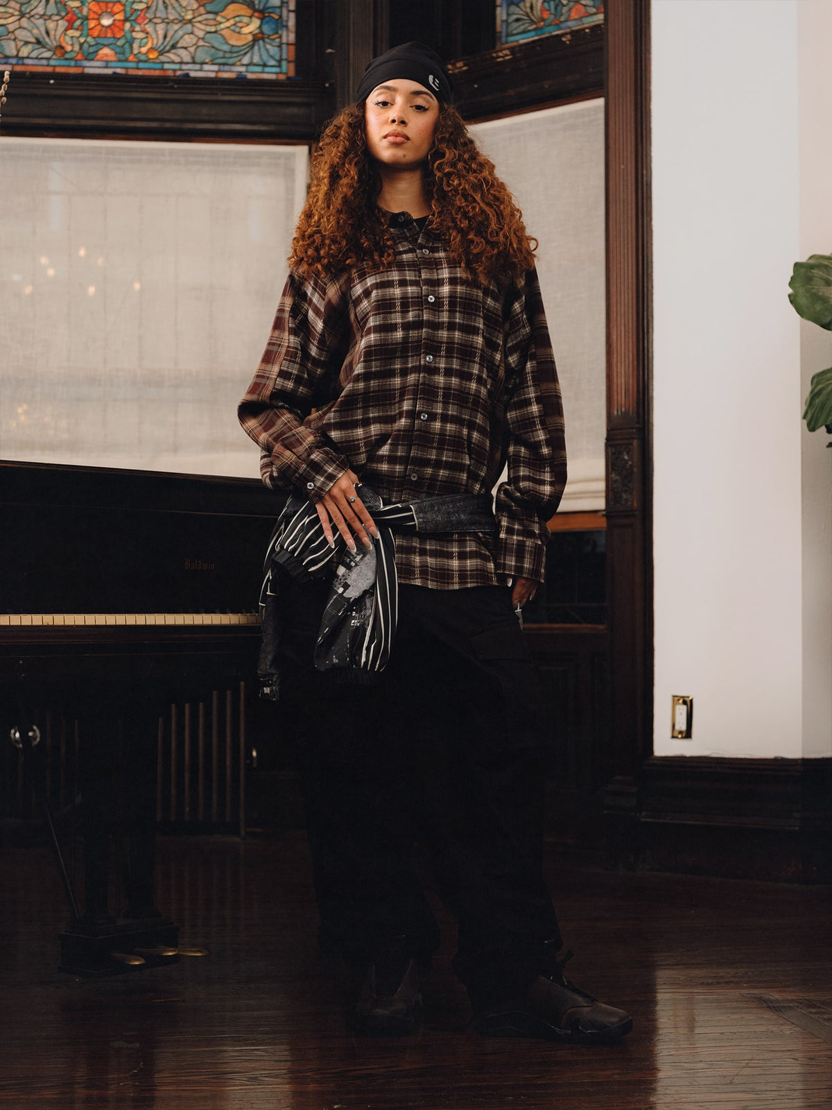 Squills (the rapper 454) and Brittney Shurley wearing Brigade FW26 in a Harlem Brownstone.