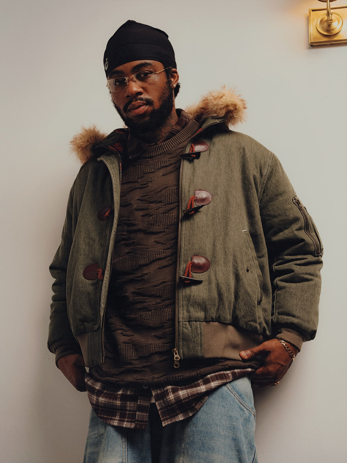 Squills (the rapper 454) and Brittney Shurley wearing Brigade FW26 in a Harlem Brownstone.