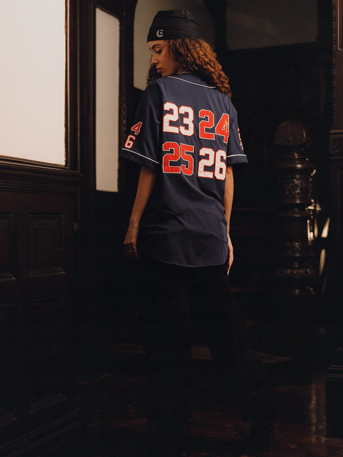 Squills (the rapper 454) and Brittney Shurley wearing Brigade FW26 in a Harlem Brownstone.